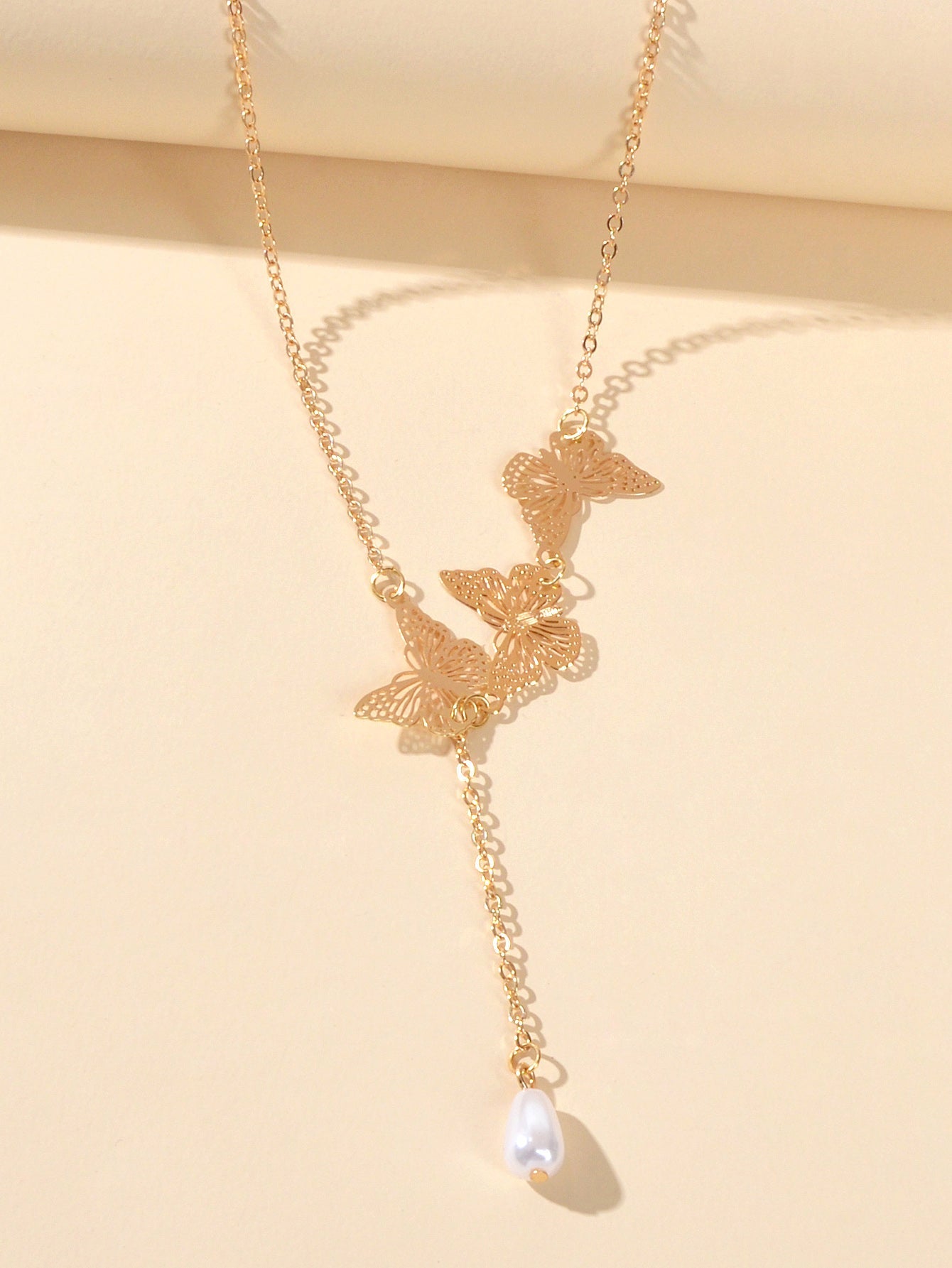 Designer Gold Butterfly Pearl Charm Personality Long Chain Dangle Y Necklace